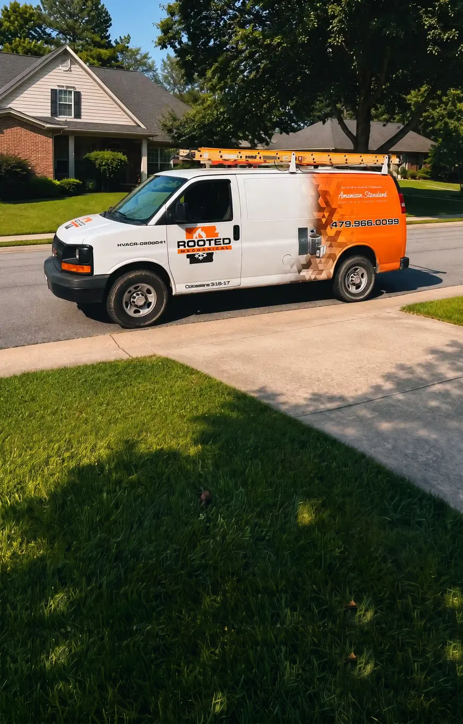 Rooted Mechanical Heating & Air service van with a ladder rack parked on a residential street