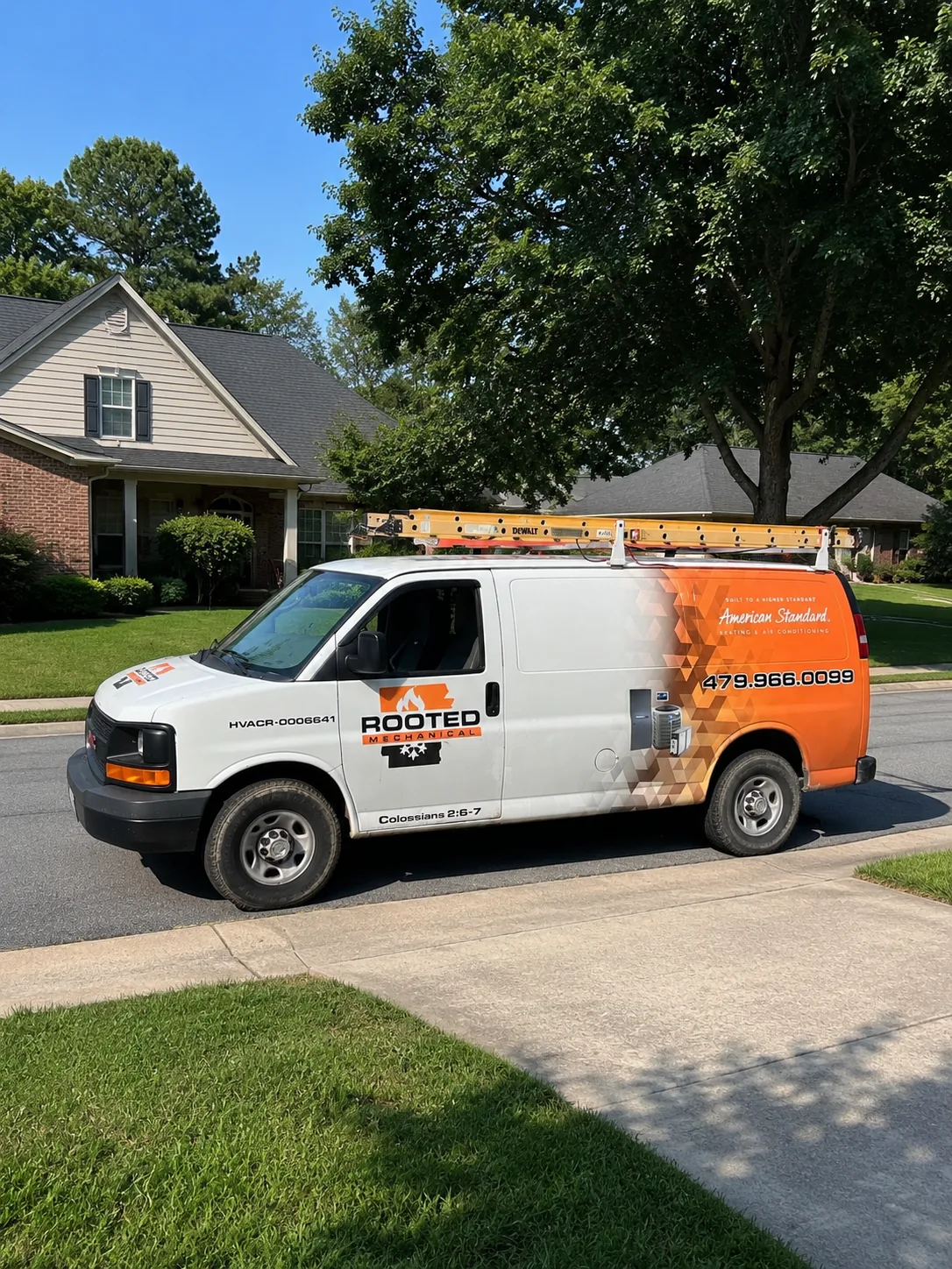 Rooted Mechanical Heating and Air service van with the company logo on the door, shown against a plain background