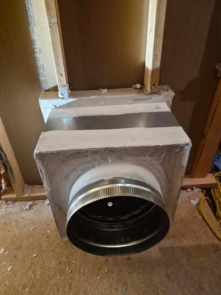 Sheet metal ductwork and a rectangular trunk line in a building under construction